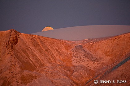 Full moon rising at the edge of the Greenland Ice Sheet where it has receded