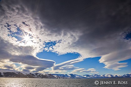 Sun and lenticular clouds over Hamiltonbukta, Spitsbergen